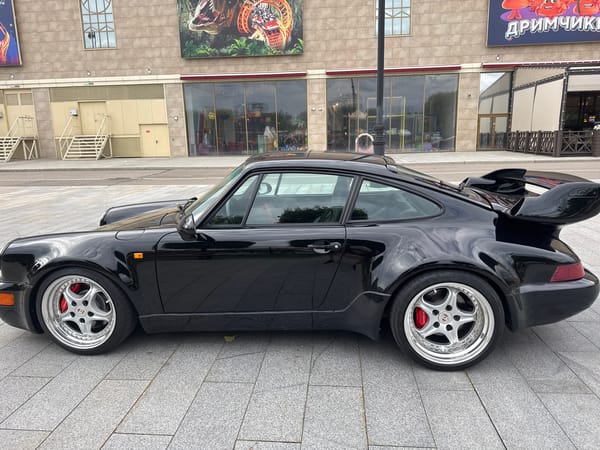 Eclectic supercar and vintage auto meetup at Moscow plaza