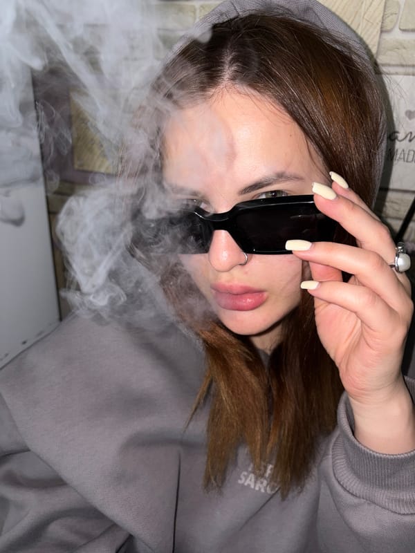Person vaping captured in portrait photos in Port-Katon