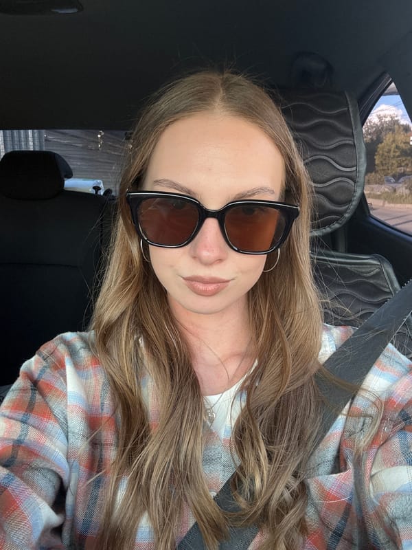 Woman takes car selfies near industrial area in Perm