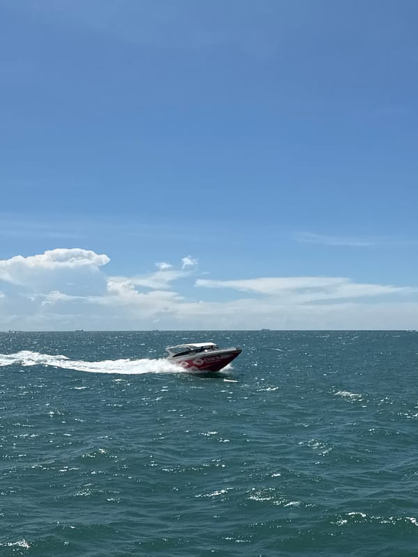 Red and white speedboat spotted crossing waters near Pattaya