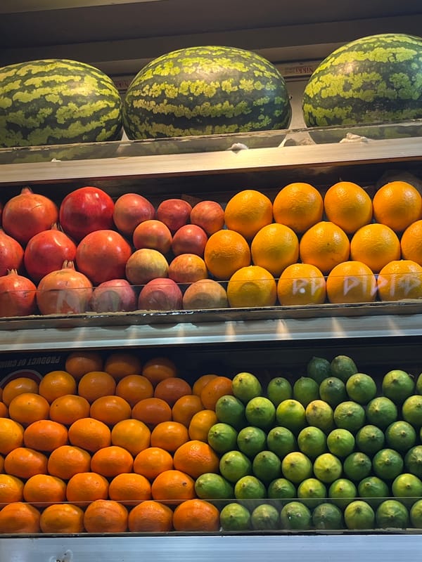 Fruit vendor displays fresh produce at Dhaka market