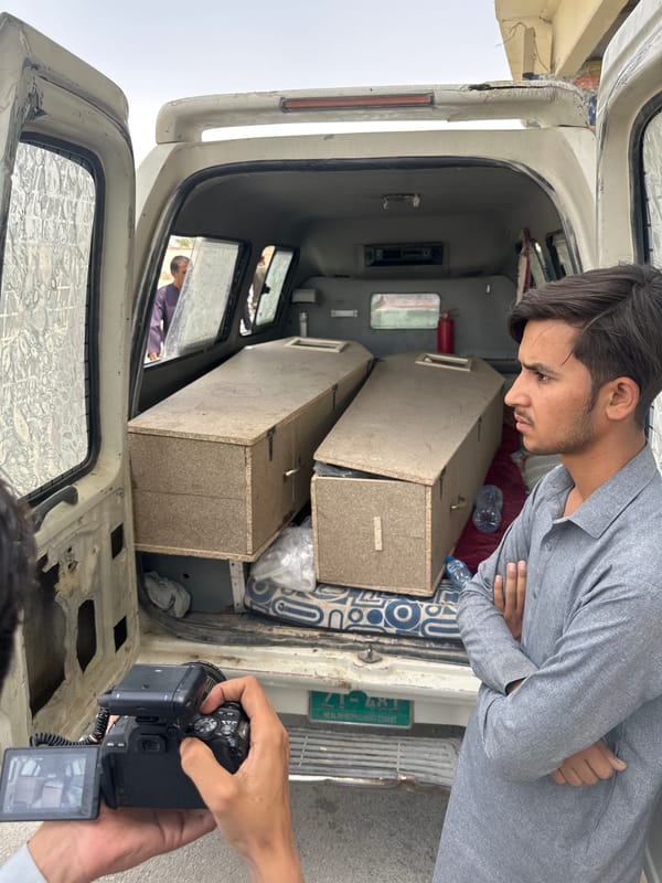 Two coffins loaded into ambulance in Quetta, Pakistan