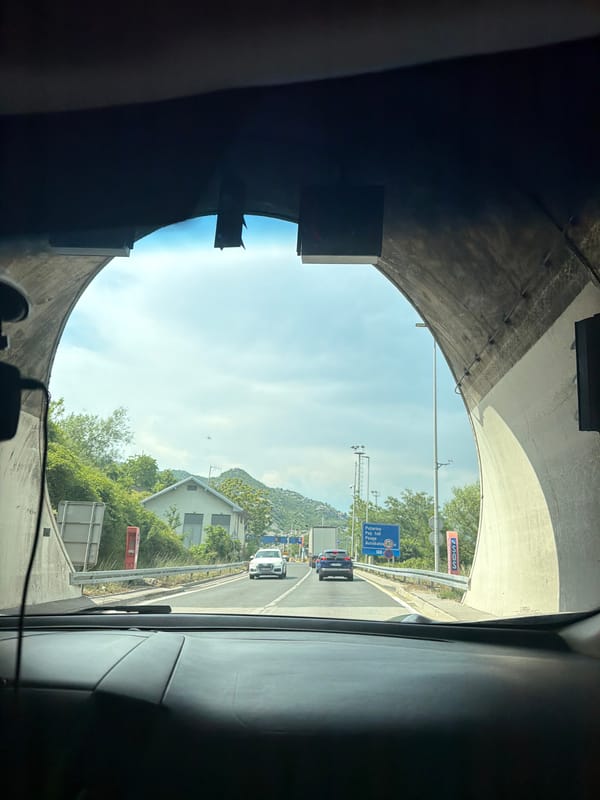 Emerging from Sozina tunnel into overcast Montenegro roads