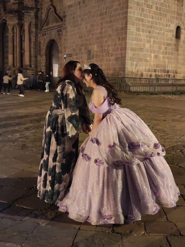 Evening plaza life documented in historic Cuzco, Peru