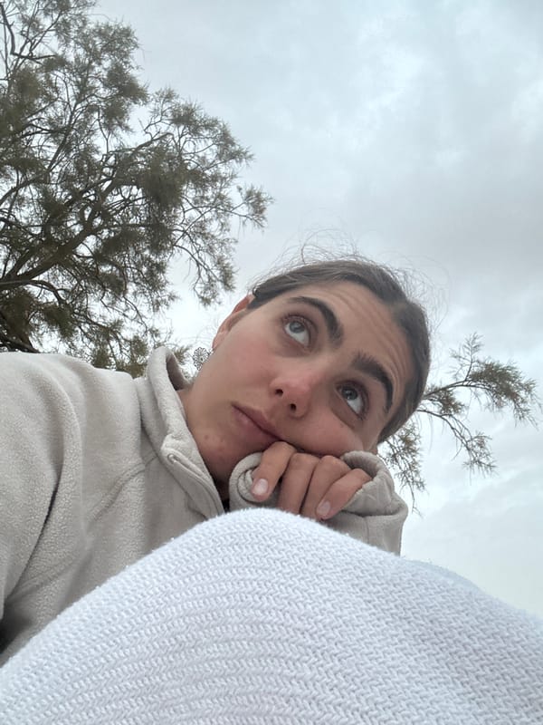 Woman takes outdoor selfies during camping trip in Israel
