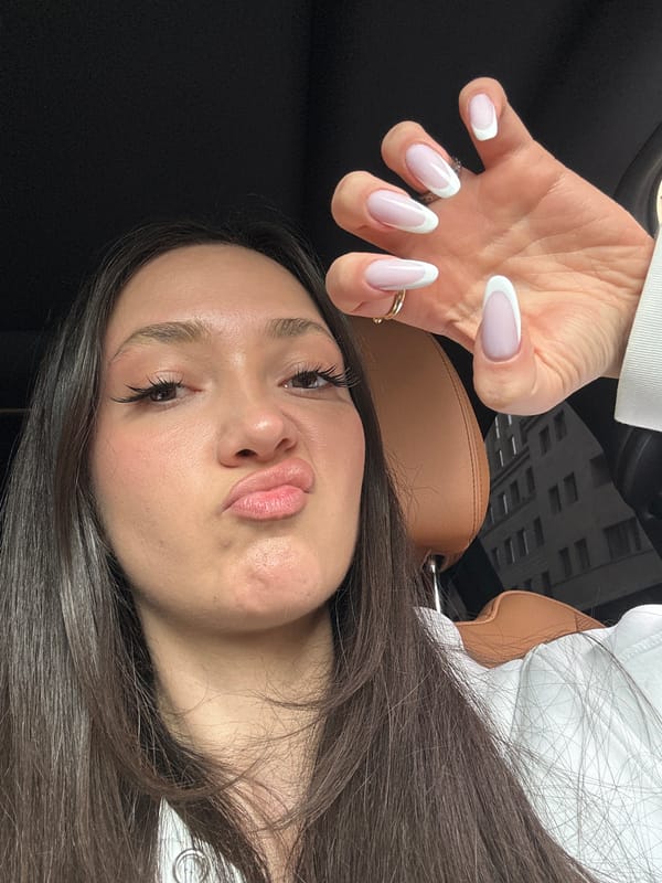 Woman takes playful selfies in BMW interior, Yerevan