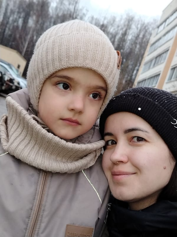 Parent and child photographed in urban winter selfie