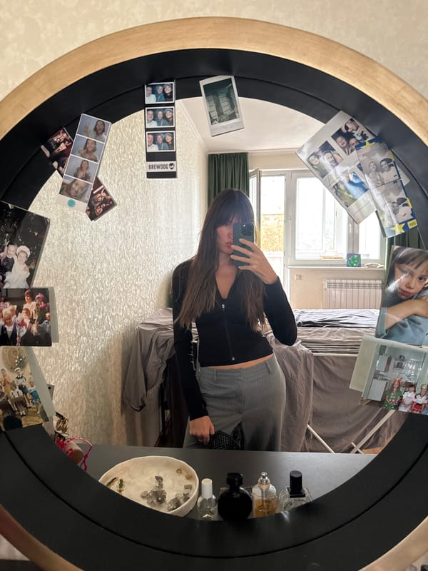 Mirror selfies and a napping cat in a Moscow bedroom