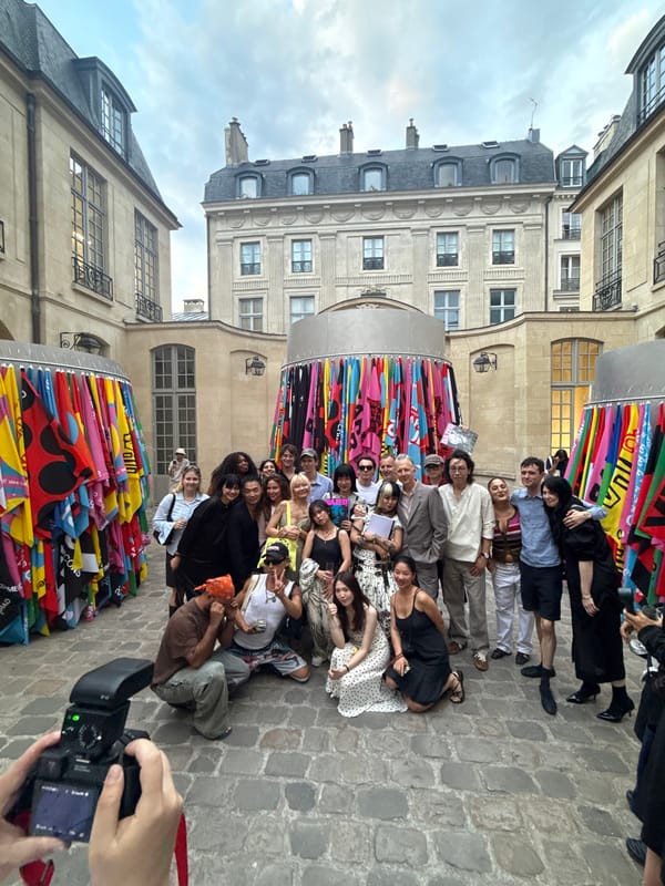 Group photo and selfie moment in a Paris courtyard