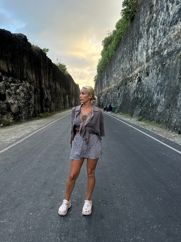 Woman photographed on coastal road in Kuta Selatan, Indonesia
