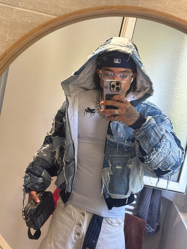 Person takes bathroom selfie in round mirror, Massy France