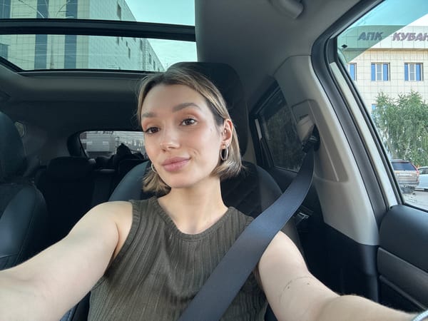 Selfie session in and around a black car with a Mario decal