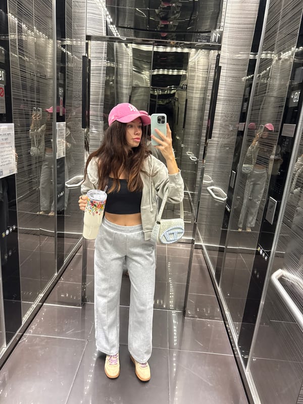 Woman takes selfie in reflective elevator in Ramat Gan