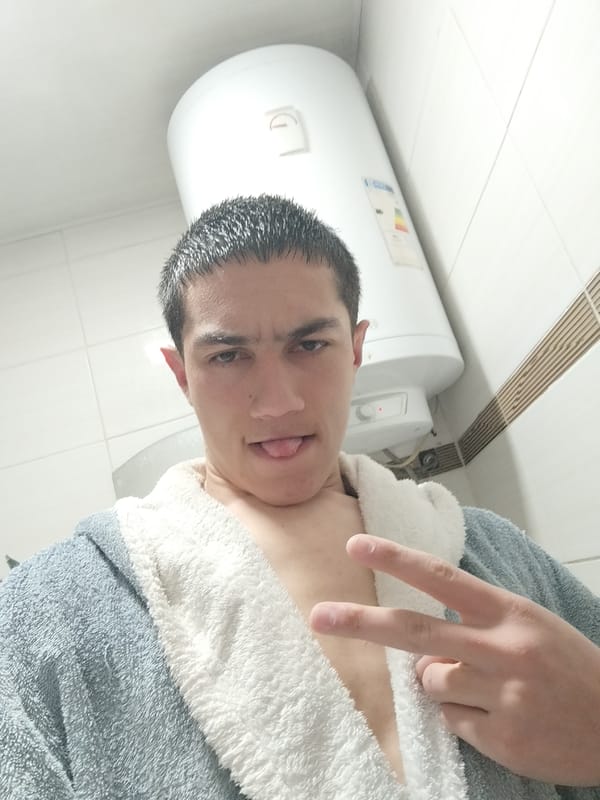 Person takes playful bathroom selfie in blue robe
