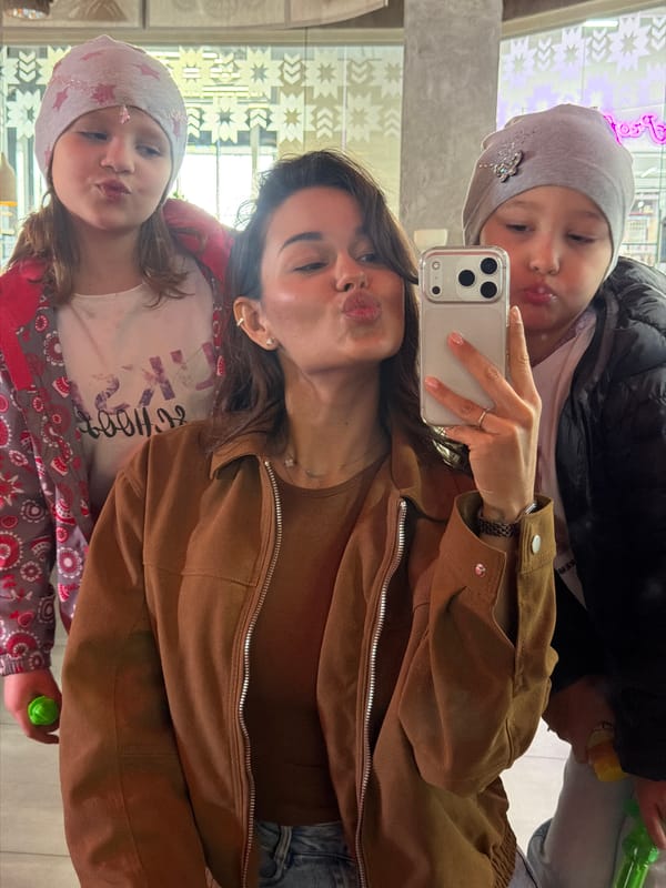 Family selfie captured at indoor venue in Krasnoyarsk