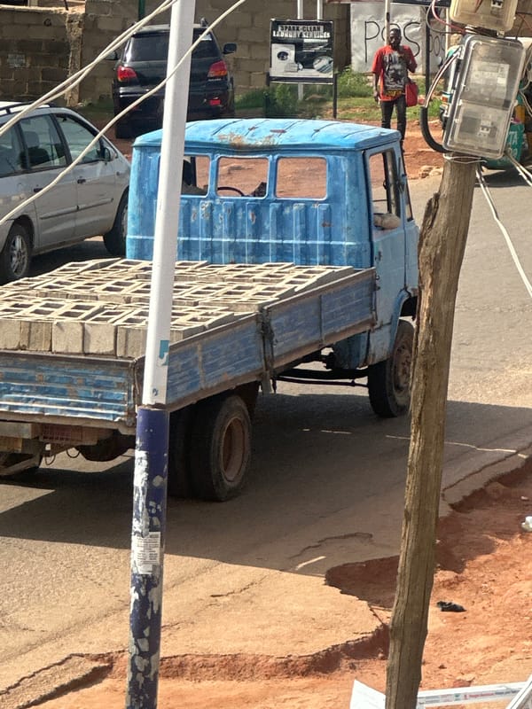 Everyday street life and resting cats in Jos, Nigeria