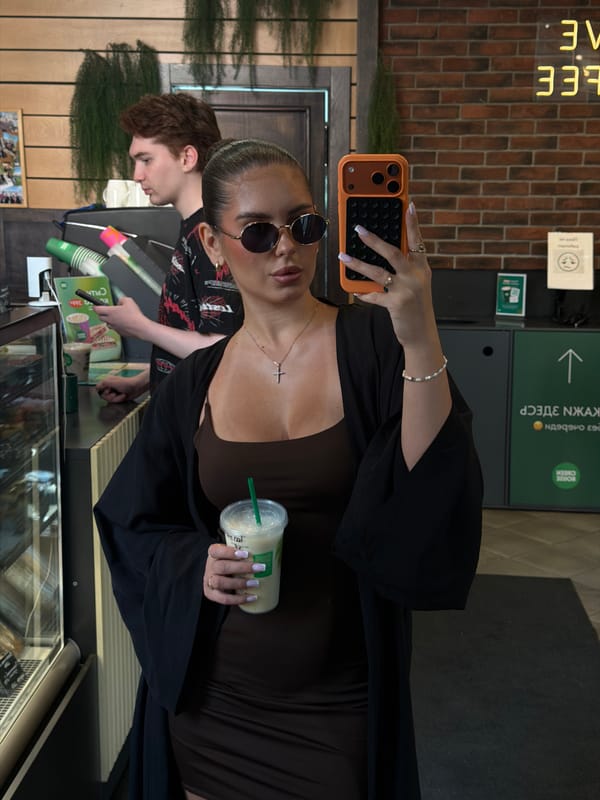 Mirror selfie at a Krasnoyarsk coffee shop