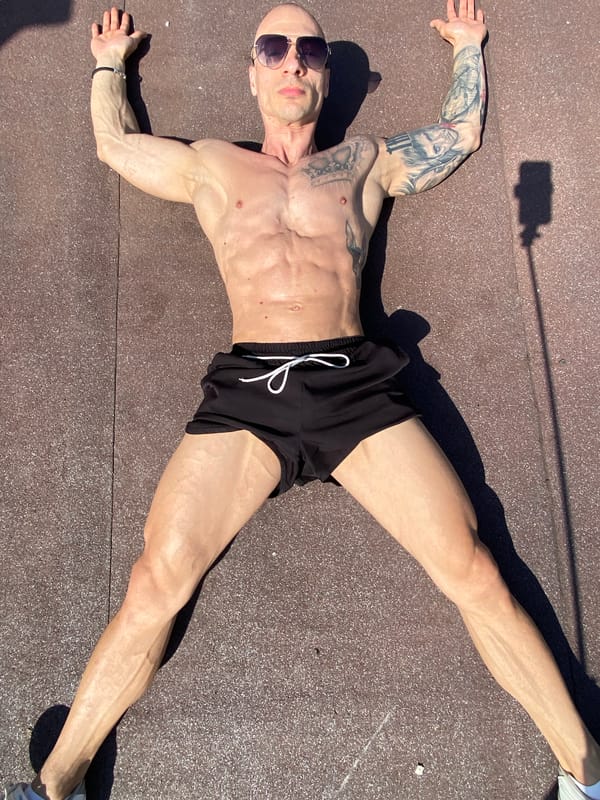 Man sunbathing on ground in Pleven, Bulgaria