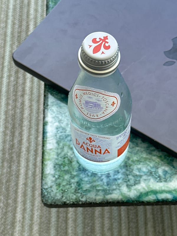 Water bottle photographed on laptop surface in Ramat HaSharon