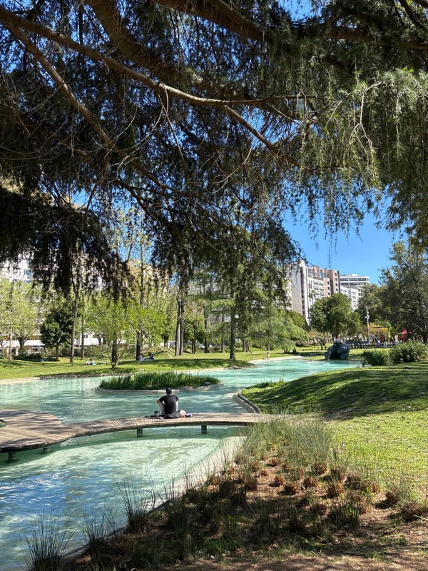 Visitors document scenic water features at Lisbon's Parque Eduardo VII