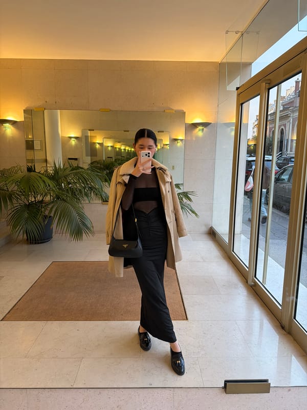 Woman takes selfie in Paris building lobby