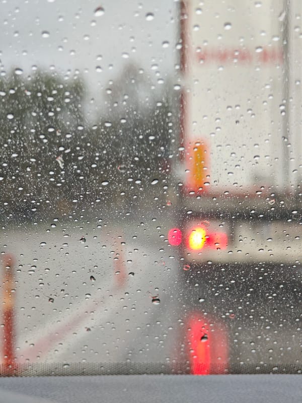 Rainy morning drive captured through windshield in Aksakovo
