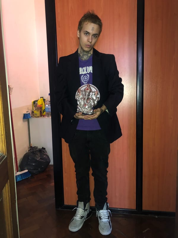 Two tattooed men documented indoors in Buenos Aires