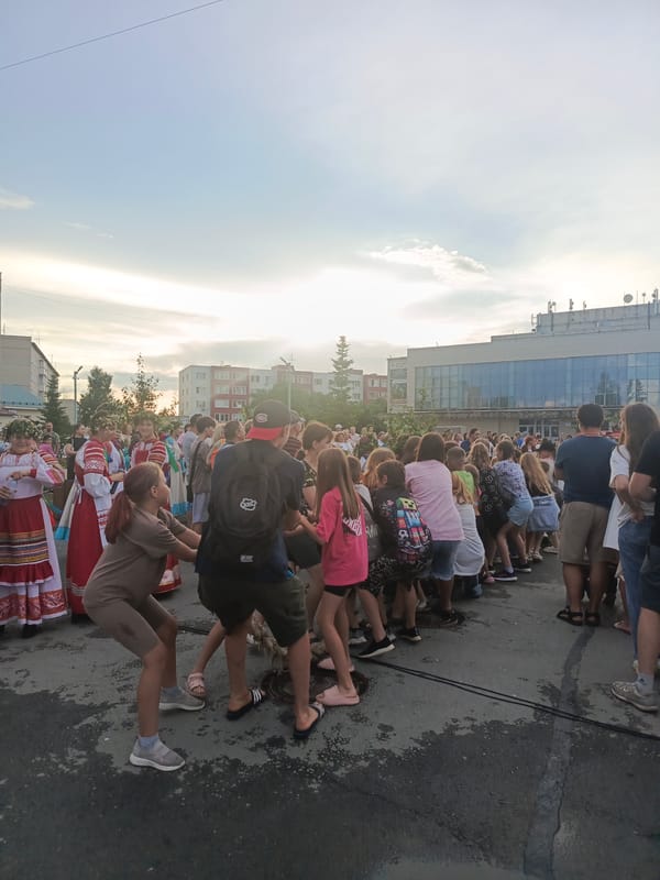Community gathering and tug-of-war in Krivodanovka, Russia