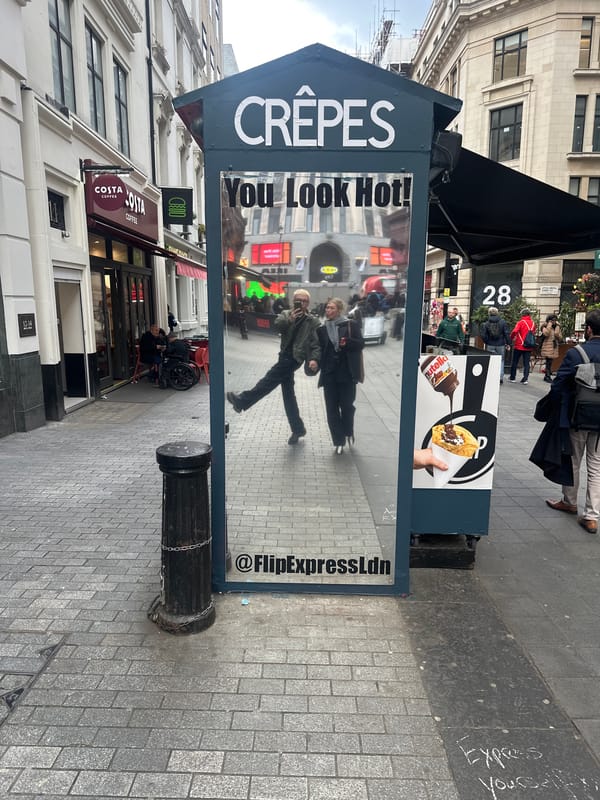 London crêpe vendor displays flirty "You Look Hot!" sign