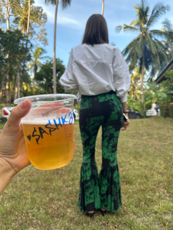 A decorated Baan Tai gathering with food and personalized cups