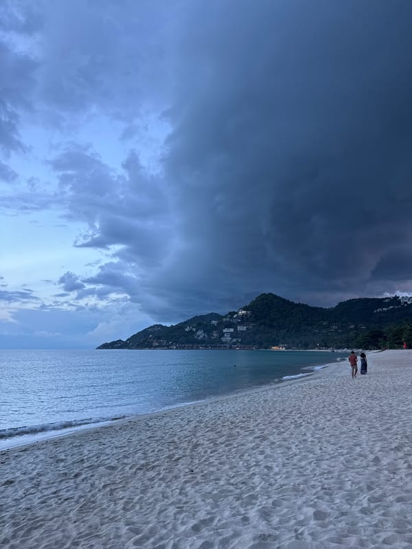 Overcast beach day at Chaweng Noi with drinks, selfies, and storm clouds