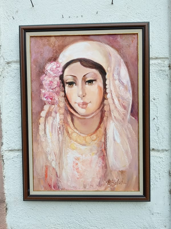 Outdoor art exhibit featuring paintings and flower clock observed in Kazanlak