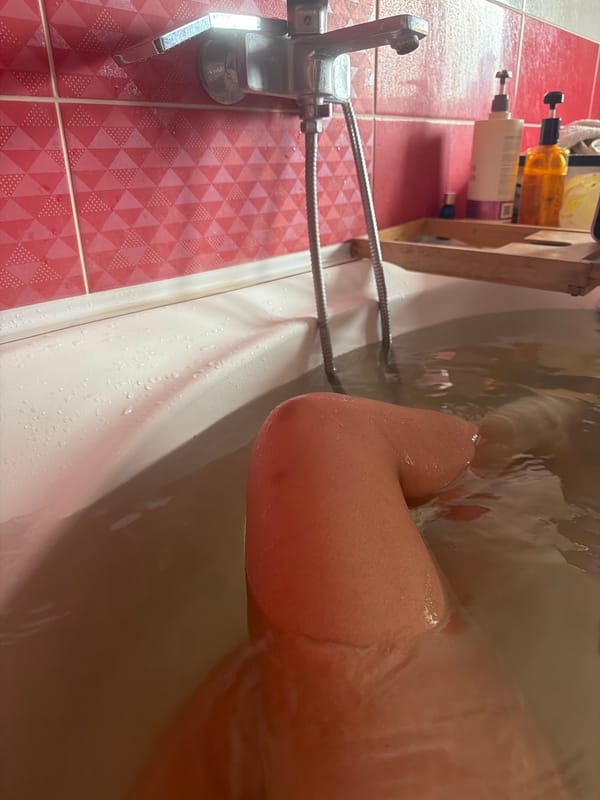 Relaxing in a tiled bathroom bathtub in rural Russia