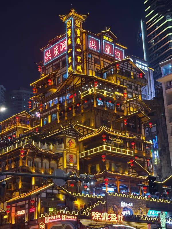 Crowds gather at Chongqing's illuminated Hongyadong tourist complex