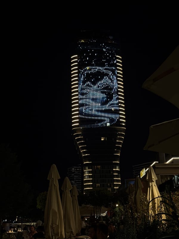 Belgrade nightlife captured with illuminated skyscraper and outdoor dining