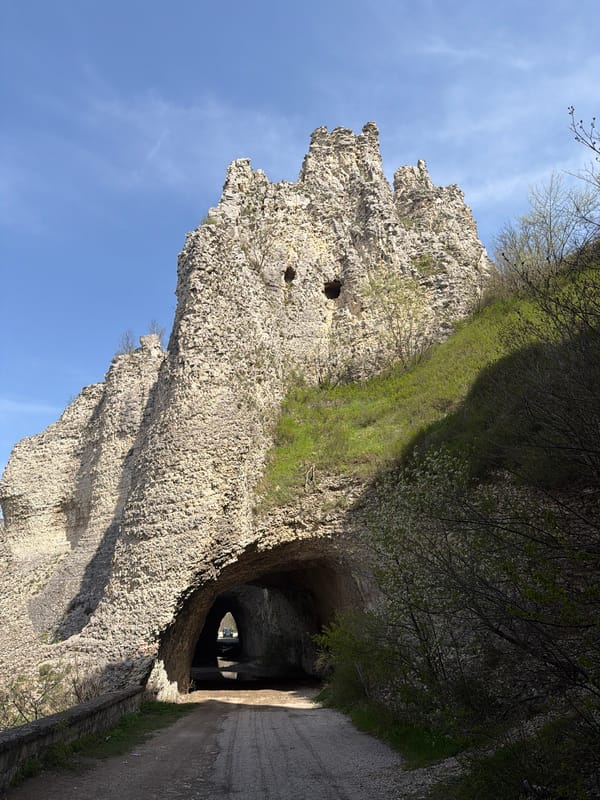 Tourist explores rock formations and bridge in Asparuhovo, Bulgaria