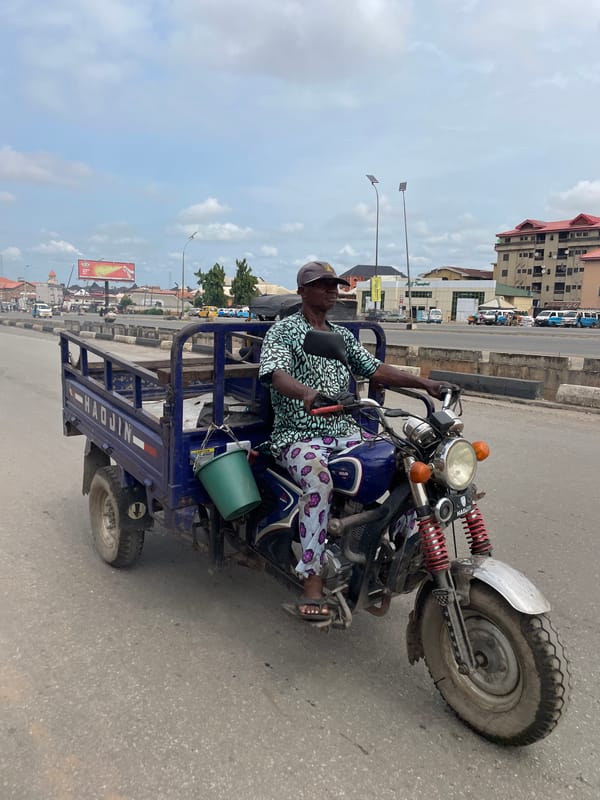 Lagos street market bustles with vendors, transport, ordinary commerce