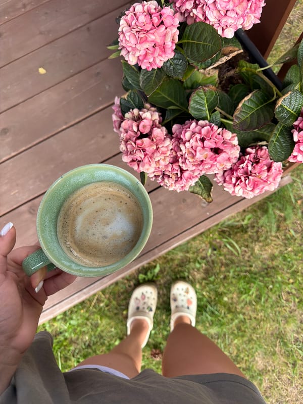 Coffee and hydrangeas on a wooden deck in Latvia