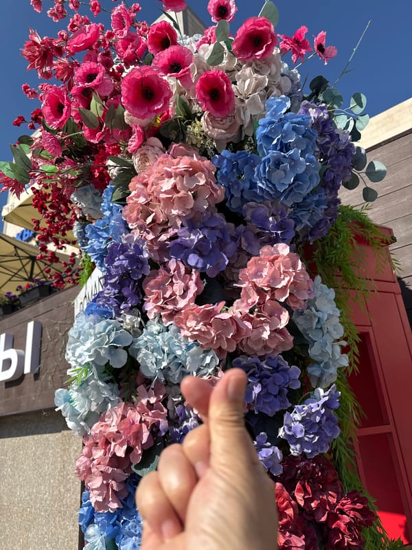 Artificial floral display against blue sky in Kokshetau