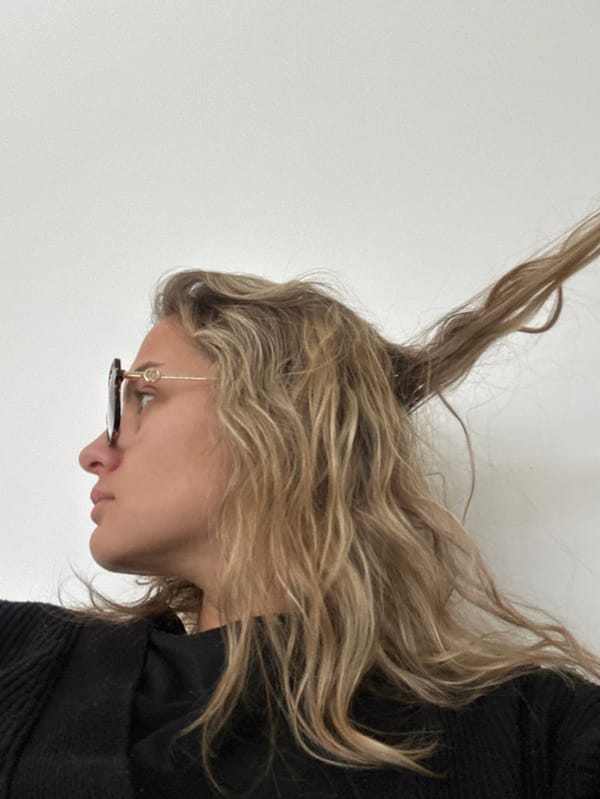 Woman documents morning selfie session at French residence
