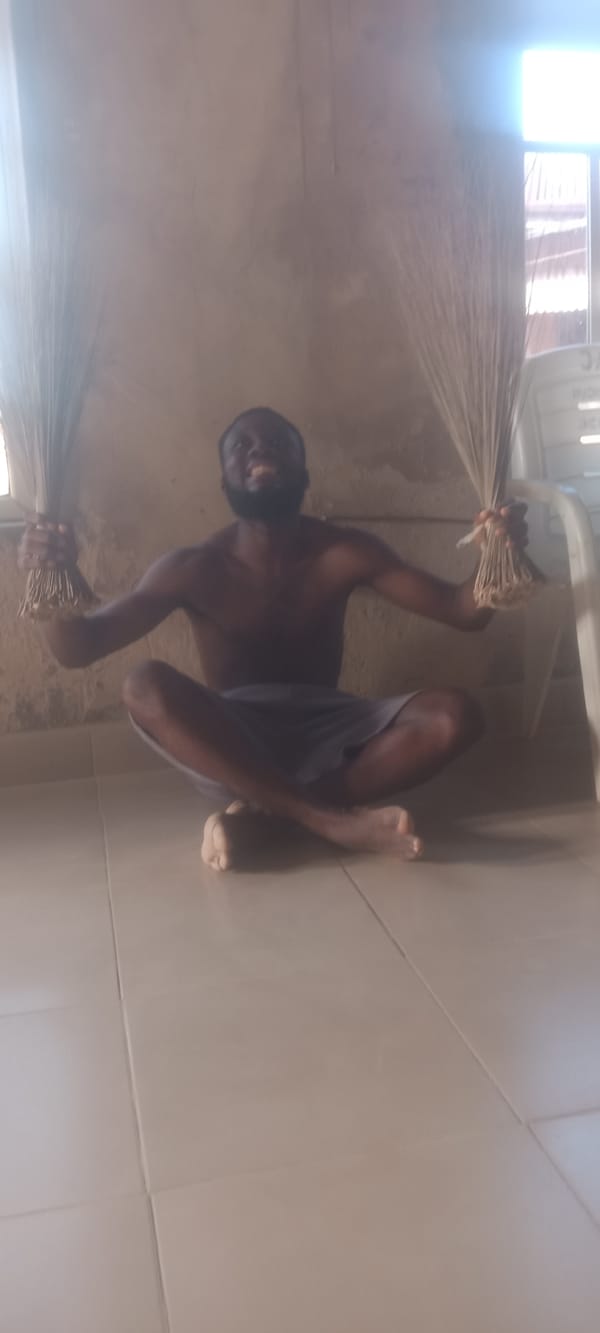 Man performs yoga, exercises with child drummer in Bende