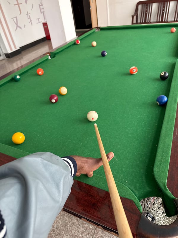 Late-night billiards session documented in Zhongtun, China