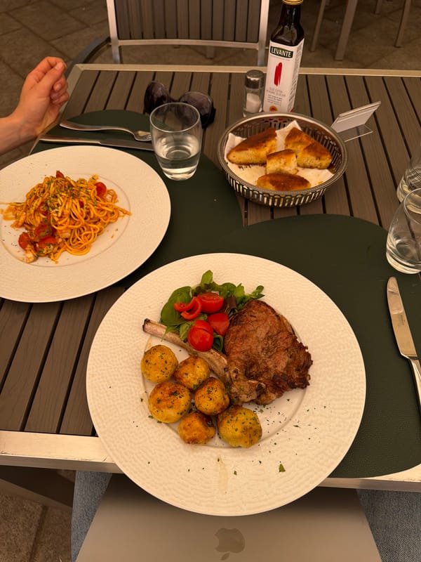 Lunch and a local monument in Milan's midday streets