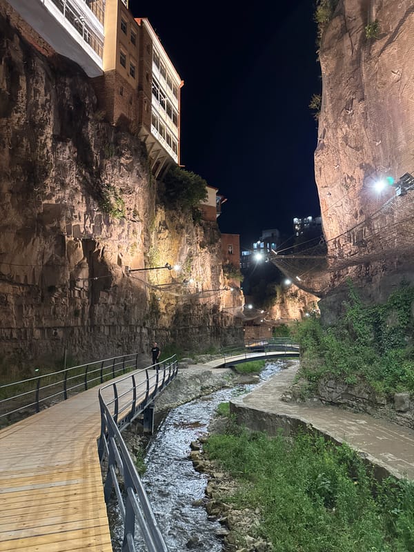 Evening in Tbilisi's Abanotubani gorge, waterfalls and string lights