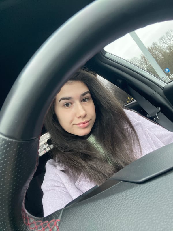 Woman takes early morning car selfie in Sofia
