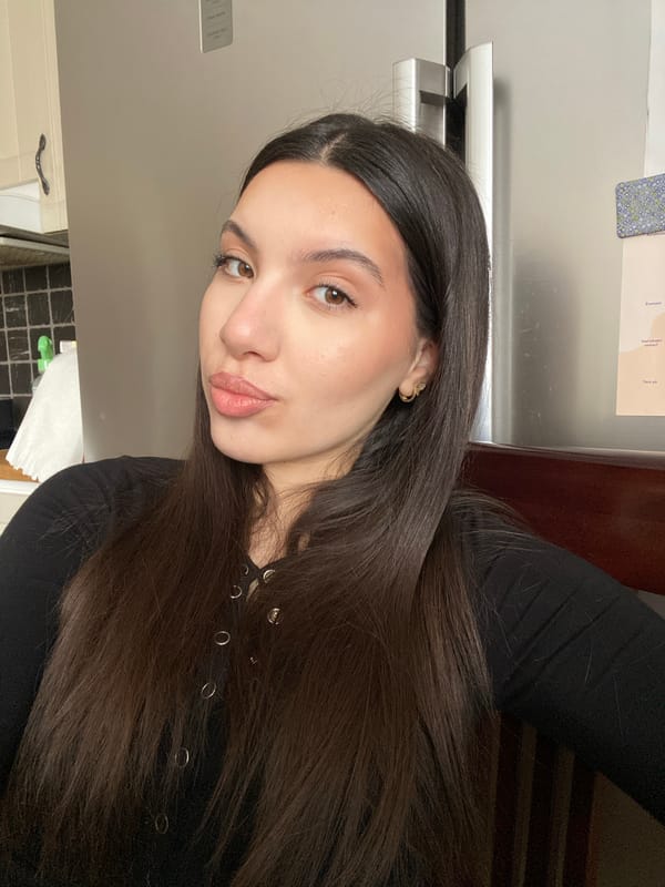 Woman enjoys morning coffee and ice cream in Swedish kitchen