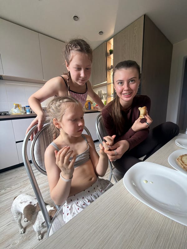 Three girls share morning kitchen moment in Dubovaya