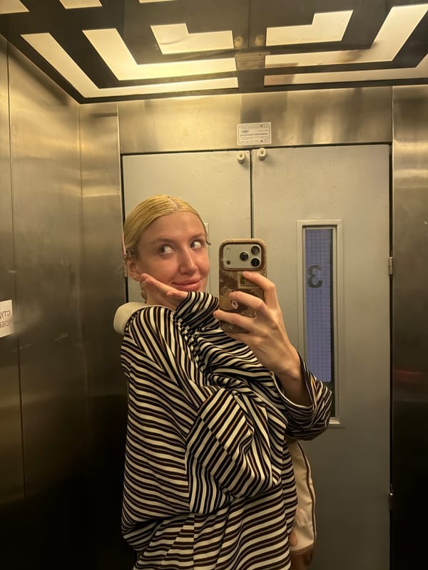 Woman takes selfie in Belgrade elevator, third floor