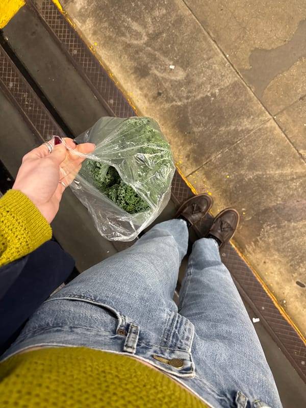 Late night commuter waits on NYC subway platform