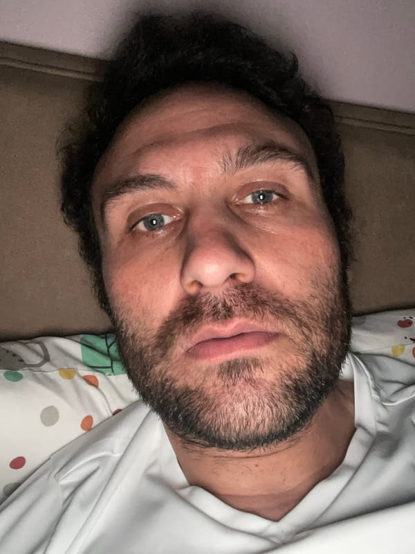 Man rests on brown surface in Armagh home